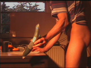 Wanking with cucumber in ass..